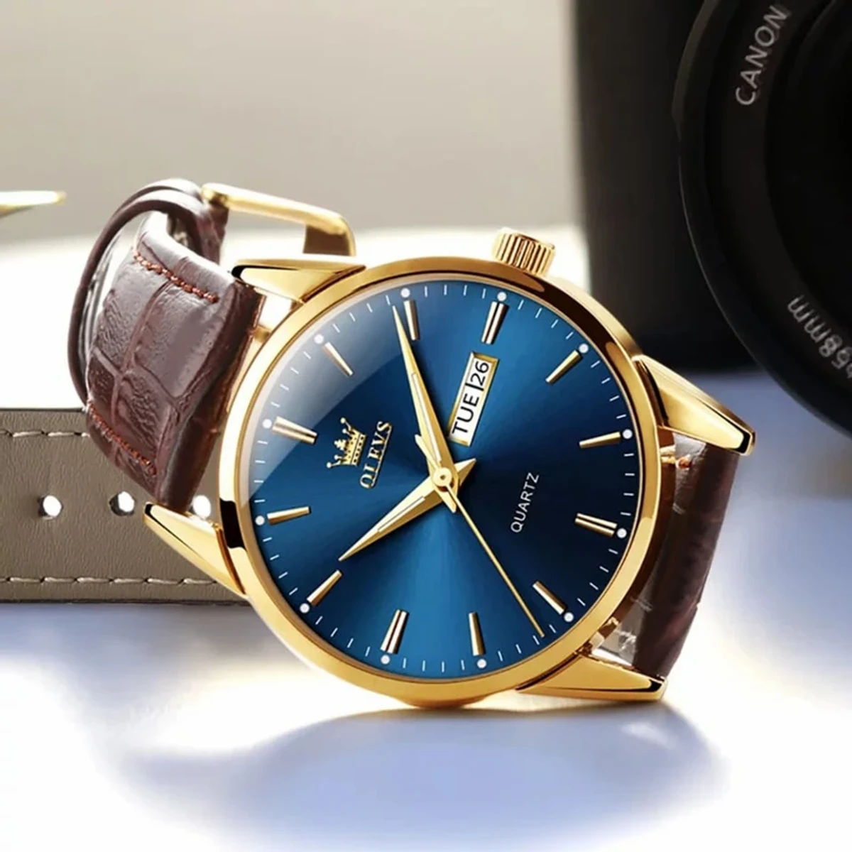 OLEVS WATCH MODEL 6898 FASHION WATCH FOR MEN BELT BROWN DIAL BLUE COLOUR WATCH FOR MEN + এক পিস ব্যাটারি ফ্রি।